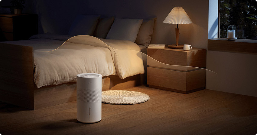 Xiaomi Smart Evaporative Humidifier Pro obok łóżka w sypialni